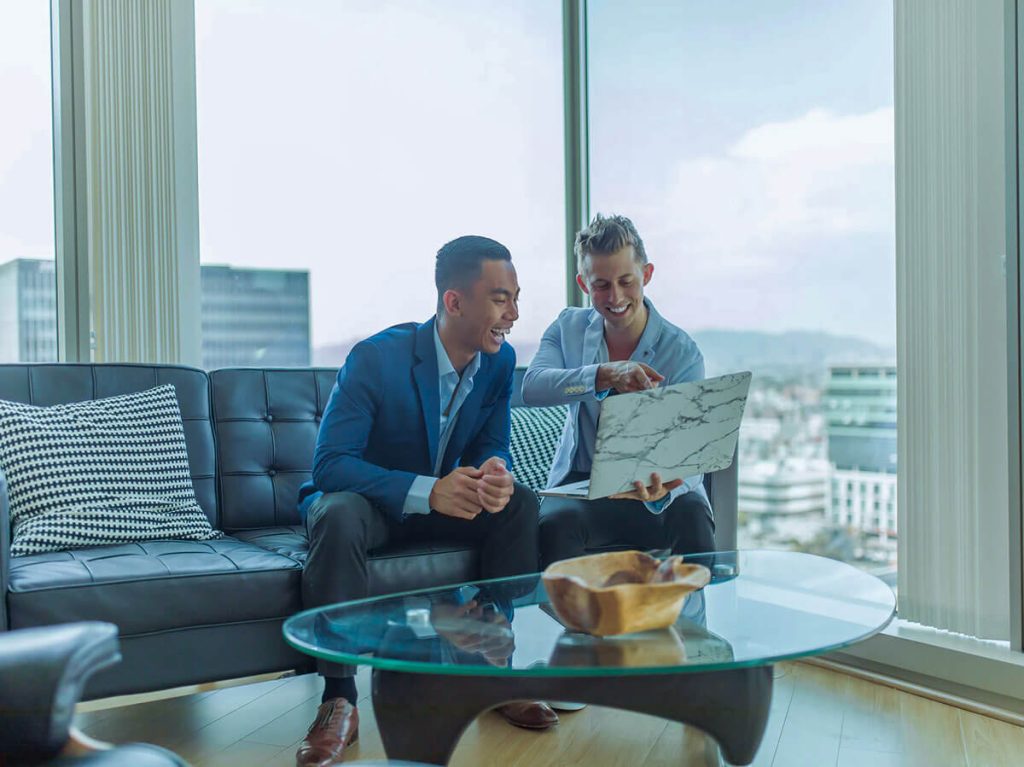 Two business persons checking accounts