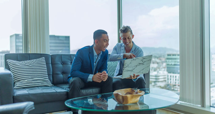 Two business persons checking accounts